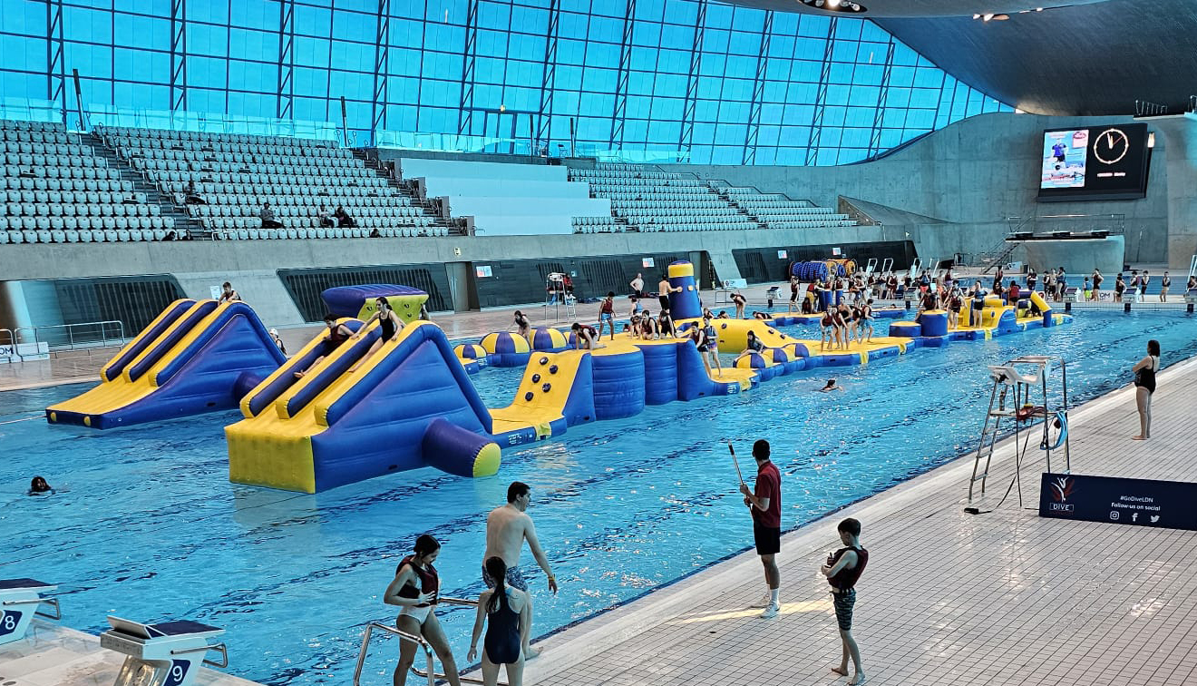 Inflatables on an indoor swimming pool.  